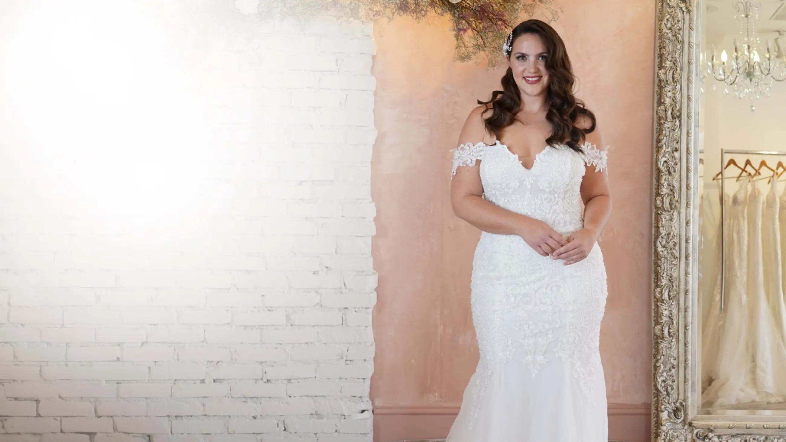 Photo of the model wearing a bridal gown.